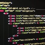 Close-up of vibrant HTML code displayed on a computer screen, showcasing web development and programming.