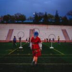 A lively Quidditch game in action at a stadium in Ankara, Türkiye, with players engaging in team sport.