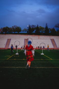 A lively Quidditch game in action at a stadium in Ankara, Türkiye, with players engaging in team sport.